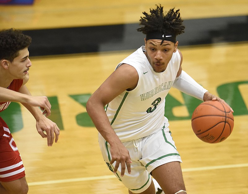 East Hamilton's Morrell Schramm dribbles downcourt during the Hurricanes' home win against Ooltewah on Friday night.