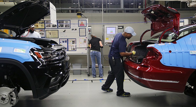 Staff file photo by Erin O. Smith / A Volkswagen employee inspects items in the trunk of a vehicle at the Volkswagen assembly plant in Chattanooga.