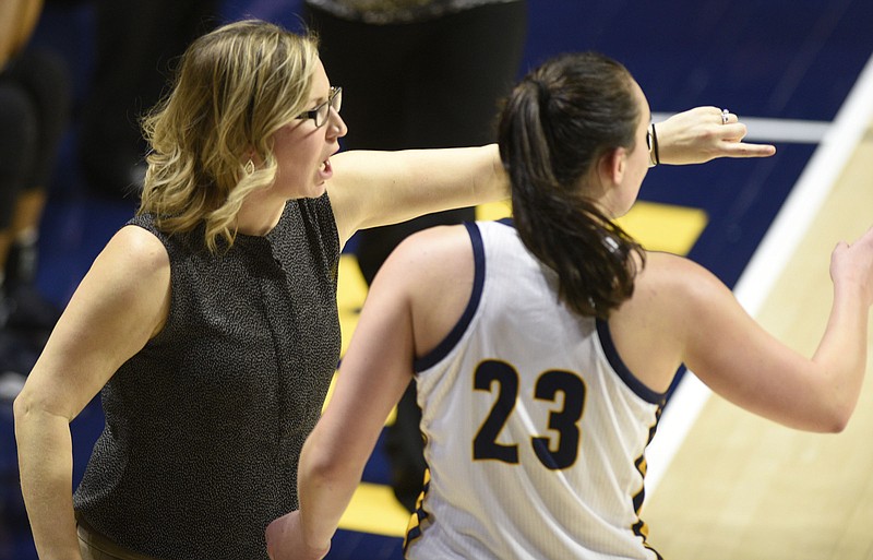 UTC women's basketball coach Katie Burrows gives instructions to sophomore guard Brooke Burns during the Mocs' 76-67 win against East Tennessee State on Saturday at McKenzie Arena.