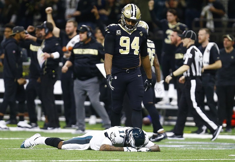 Philadelphia Eagles wide receiver Alshon Jeffery lies on the turf at the Superdome in front of New Orleans defensive end Cameron Jordan after the Saints intercepted a pass in the second half of Sunday's NFC divisional-round playoff game in New Orleans.