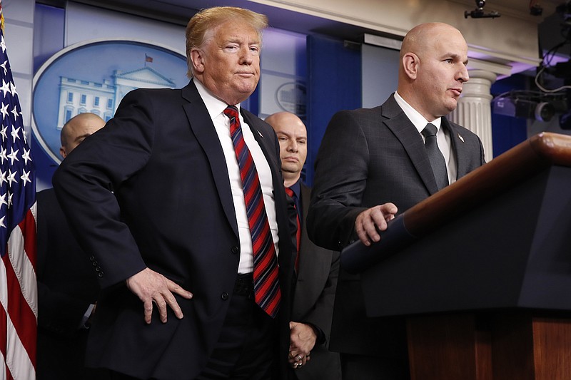 In this Jan. 3, 2019, file photo, President Donald Trump, left, listens as Brandon Judd, president of the National Border Patrol Council, talks about border security after making a surprise visit to the press briefing room of the White House in Washington. Trump and Judd share an ominous view of the Southern border and a certainty that a wall along the boundary is urgently needed to stop what they've described as a humanitarian crisis. (AP Photo/Jacquelyn Martin, File)