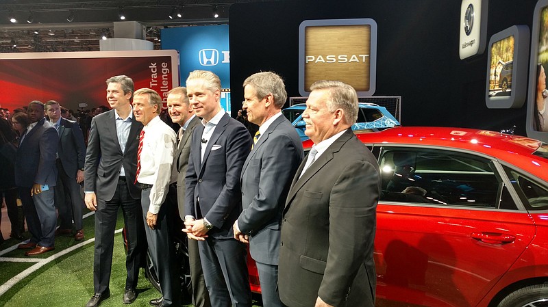 An announcement of an $800 million expansion at Chattanooga's Volkswagen plant brought out top officials on Monday in Detroit. From left are Chattanooga Mayor Andy Berke, Tennessee Gov. Bill Haslam, VW Group CEO Herbert Diess, Volkswagen Group of America CEO Scott Keogh, Tennessee Gov.-elect Bill Lee, and Hamilton County Mayor Jim Coppinger. (Staff photo by Mike Pare)