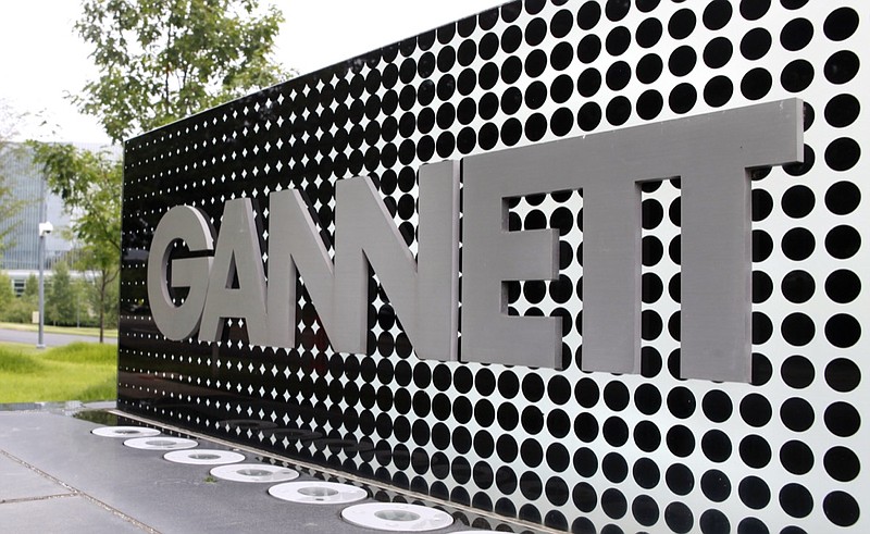 In this July 14, 2010, file photo, the Gannett Co.headquarters sign stands in McLean, Va. The Wall Street Journal is reporting that MNG Enterprises, better known as Digital First Media, is preparing to bid for newspaper publisher Gannett Co. (AP Photo/Jacquelyn Martin, File)