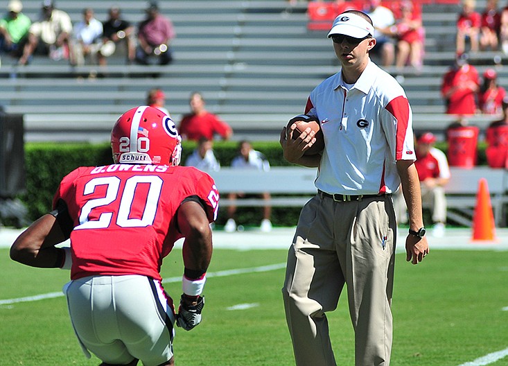 Todd Hartley, shown here as a Georgia graduate assistant working with cornerback Derek Owens during the 2010 season, was announced Monday as the new tight ends coach of the Bulldogs.