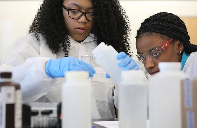 Chattanooga Girls Leadership Academy students Avery Love, 15, and Taliyah Sanford, 14, measure out water samples for testing Tuesday, January 15, 2019 at the Tennessee Aquarium Conservation Institute in Chattanooga, Tennessee. Students broke out in groups to do a variety of tests with Tennessee American Water representatives. 