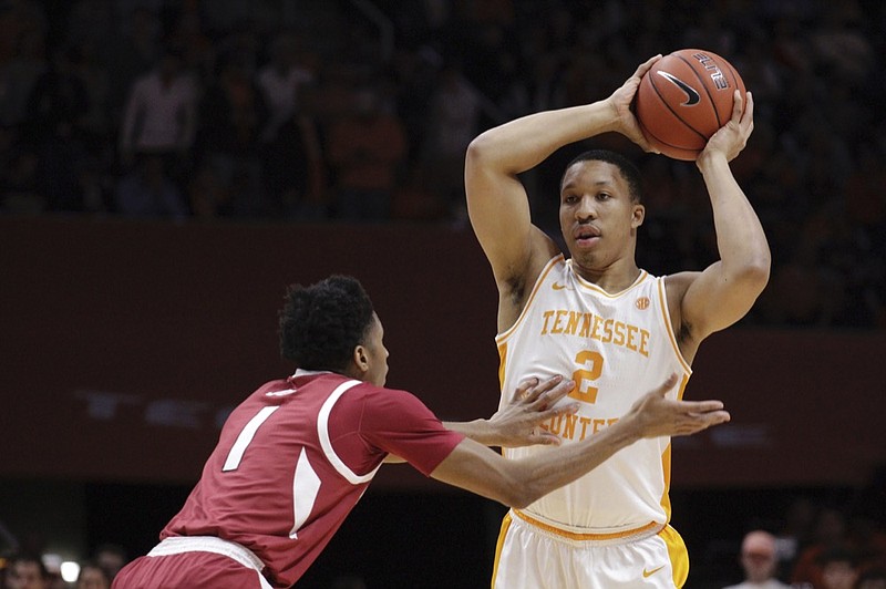 Tennessee forward Grant Williams (2) looks to pass while Arkansas guard Isaiah Joe (1) defends in the first half of an NCAA college basketball game, Tuesday, Jan. 15, 2019, in Knoxville, Tenn. (AP Photo/Shawn Millsaps)

