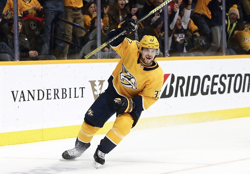 Nashville Predators left wing Viktor Arvidsson, of Sweden, celebrates after scoring his third goal of the night for a hat trick against the Washington Capitals, during the second period of an NHL hockey game Tuesday, Jan. 15, 2019, in Nashville, Tenn. (AP Photo/Mark Humphrey)

