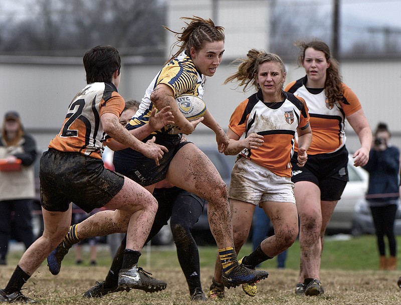 Allie Schrenker, of Bristol, Tenn., shown here carrying the ball, has emerged as a star player on the University of Tennessee at Chattanooga women's rugby team. (UTC photo by Billy Weeks)

