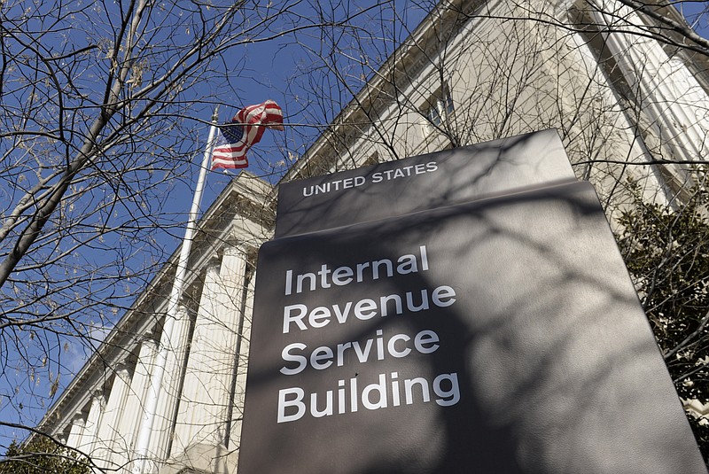 FILE - This March 22, 2013 file photo, shows the exterior of the Internal Revenue Service building in Washington. The Internal Revenue Service is recalling about 46,000 of its employees furloughed by the government shutdown, nearly 60 percent of its workforce, to handle tax returns and pay out refunds. The employees won't be paid. (AP Photo/Susan Walsh, File)
