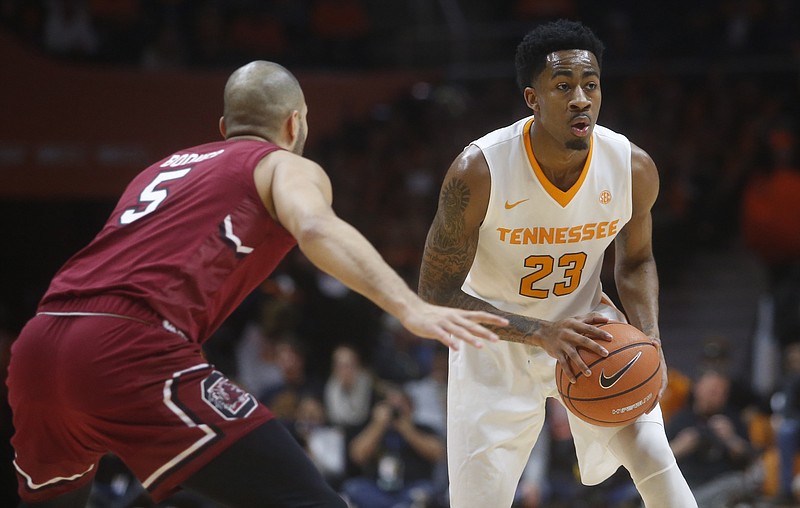 Tennessee's Jordan Bowden (23) is guarded by South Carolina's Frank Booker during a game in Knoxville in February 2018.