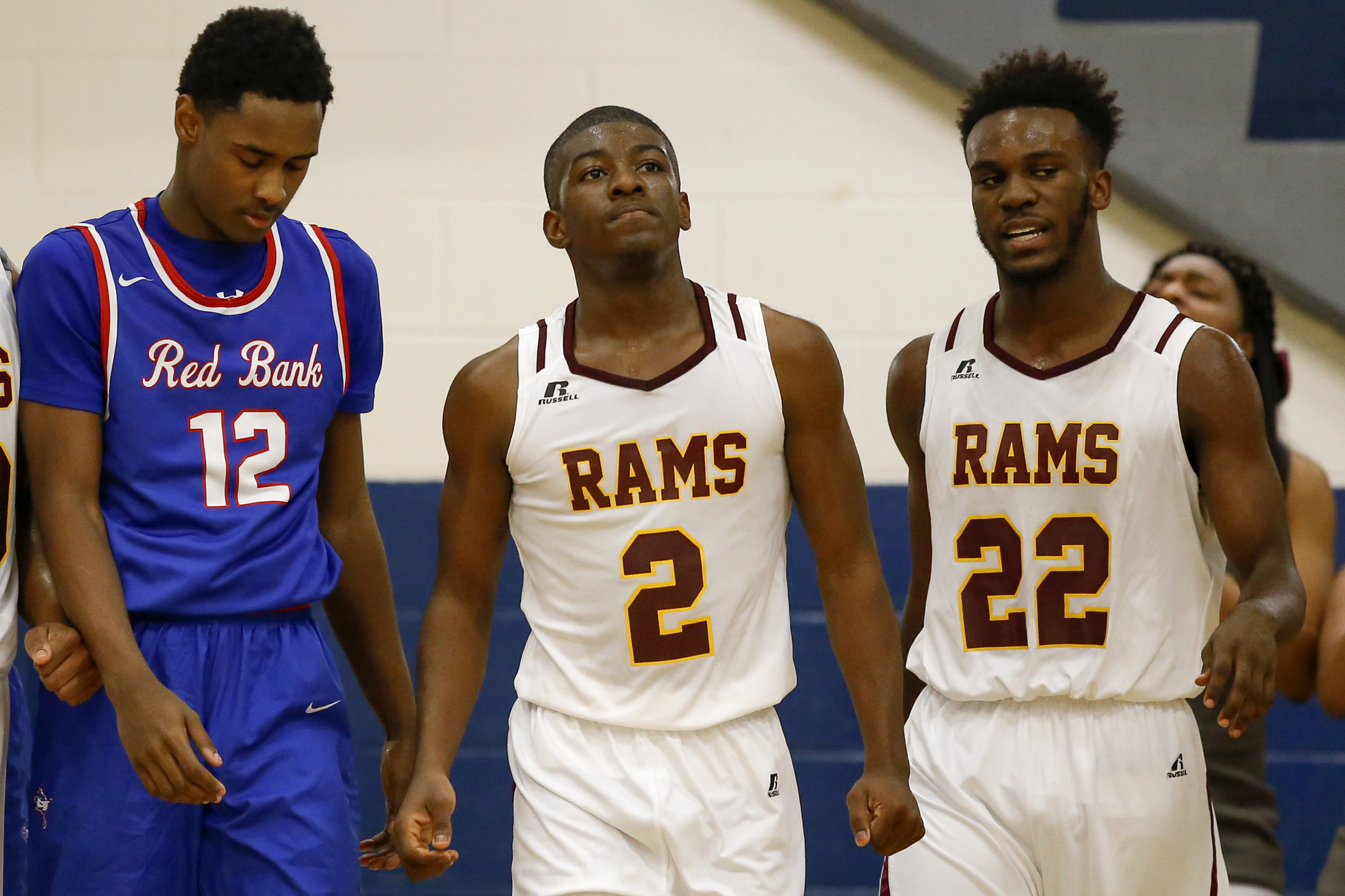 Tyner's Javon Craddock, center, walks down the court during a Region 3-AA basketball tournament semifinal against host Red Bank last February. Craddock was 16 when he died of a rare heart defect last May, but the Rams' memories of their late teammate are pushing them to return to the state tournament this season.