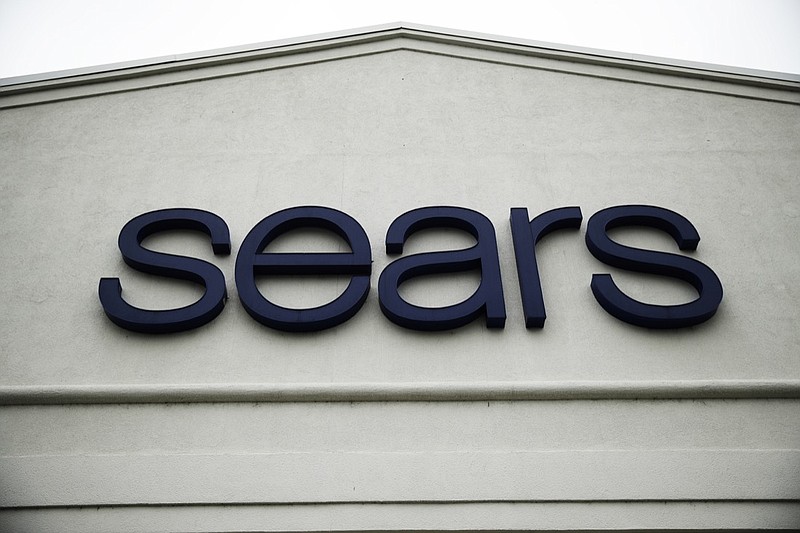 This Oct. 15, 2018 file photo shows a sign for a Sears Outlet department store is displayed in Norristown, Pa.  Multiple media outlets reported early Wednesday, Jan. 16, 2019, that billionaire Eddie Lampert has won a bankruptcy auction after strengthening his bid in several days of negotiations with creditors. Lampert, Sears' chairman and largest shareholder, upped his offer to more than $5 billion and added a $120 million cash deposit through an affiliate of his ESL hedge fund.  (AP Photo/Matt Rourke, File)