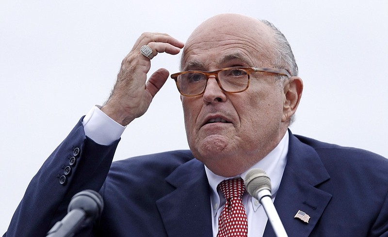 In this Aug. 1, 2018 file photo, Rudy Giuliani, an attorney for President Donald Trump, addresses a gathering during a campaign event fin Portsmouth, N.H. Giuliani says he's never said there was no collusion between Russia and members of the Trump campaign. Giuliani's comments Wednesday night on CNN directly contradict the position of his own client, who has repeatedly insisted that there was no collusion during his successful 2016 presidential campaign. Giuliani himself has described the idea of Russian collusion as "total fake news." (AP Photo/Charles Krupa, File )