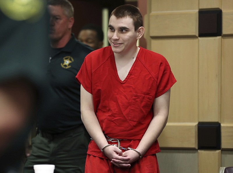 Parkland school shooting suspect Nikolas Cruz enters the courtroom for a hearing at the Broward Courthouse in Fort Lauderdale, Fla., Tuesday, Jan. 15, 2019. Cruz returned court this week for hearings on the Valentine's Day 2018 shooting at Marjory Stoneman Douglas High School in Parkland, Fla., and on accusations he assaulted a corrections officer. (Amy Beth Bennett/South Florida Sun-Sentinel via AP, Pool)

