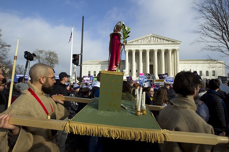 Anti-abortion activists march outside of the U.S. Supreme Court, during the March for Life in Washington Friday, Jan. 18, 2019. (AP Photo/Jose Luis Magana)

