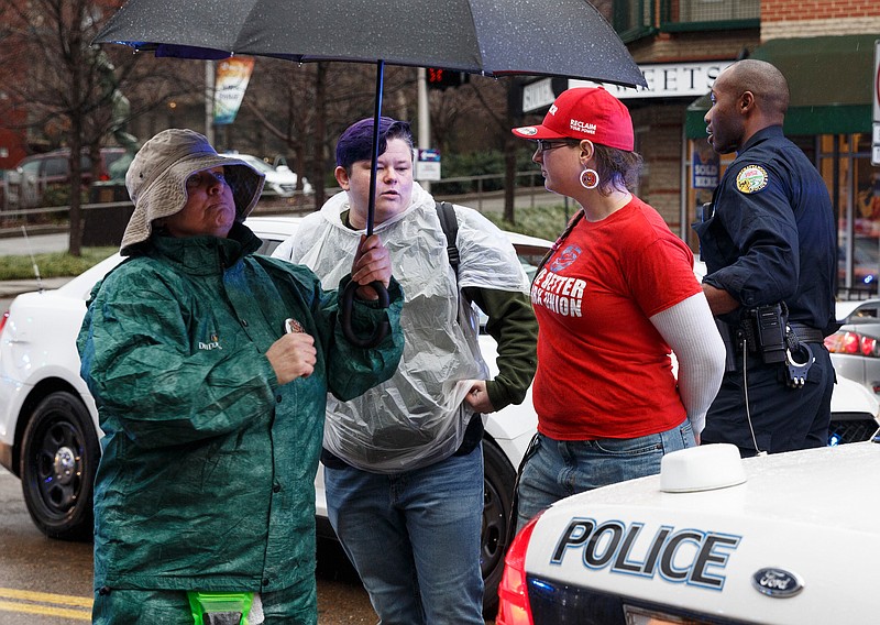 Staff photo by Doug Strickland / 
Holly Lynn Selvwv, identified by police as Holly Johnson, right, is arrested during the Chattanooga Women's March on Saturday, Jan. 19, 2019, in Chattanooga, Tenn. Multiple demonstrators were arrested during the march after walking in Market Street and ignoring police orders to move to the sidewalk.     