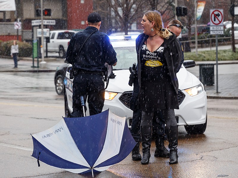 Staff photo by Doug Strickland / 
The Rev. Alaina Cobb shouts as she is arrested during the Chattanooga Women's March on Saturday, Jan. 19, 2019, in Chattanooga, Tenn. Multiple demonstrators were arrested during the march after walking in Market Street and ignoring police orders to move to the sidewalk.   