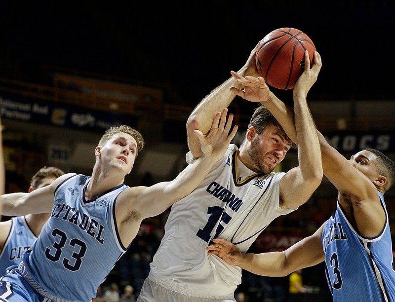 UTC forward Ramon Vila, center, gets caught between The Citadel's Hayden Brown, left, and Lew Stallworth during Saturday's SoCon matchup at McKenzie Arena.