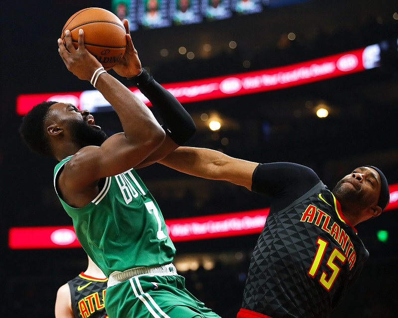 Boston Celtics guard Jaylen Brown shoots over Atlanta Hawks forward Vince Carter during the first half of Saturday night's game in Atlanta.
