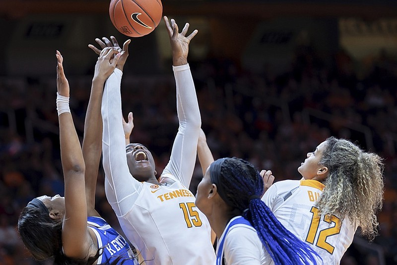 Tennessee and Kentucky basketball players battle for a rebound during their SEC game Jan. 10 in Knoxville.