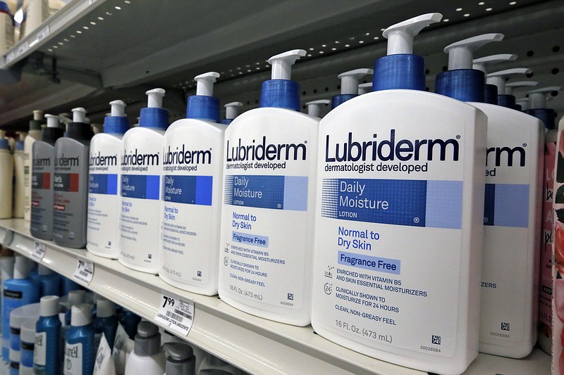 FILE- This Nov. 14, 2018, file photo shows Lubriderm, a Johnson & Johnson product, on display at a market in Pittsburgh. Johnson & Johnson reports financial results Tuesday, Jan. 22, 2019. (AP Photo/Gene J. Puskar, File)