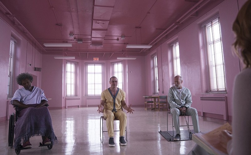 This image released by Universal Pictures shows Samuel L. Jackson, from left, James McAvoy and Bruce Willis in a scene from M. Night Shyamalan's "Glass." (Jessica Kourkounis/Universal Pictures via AP)