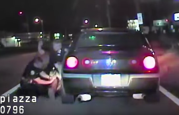 This frame grab from video shows Chattanooga police officer Benjamin Piazza punching 37-year-old Fredrico Wolfe several times during a traffic stop on March 3, 2018.