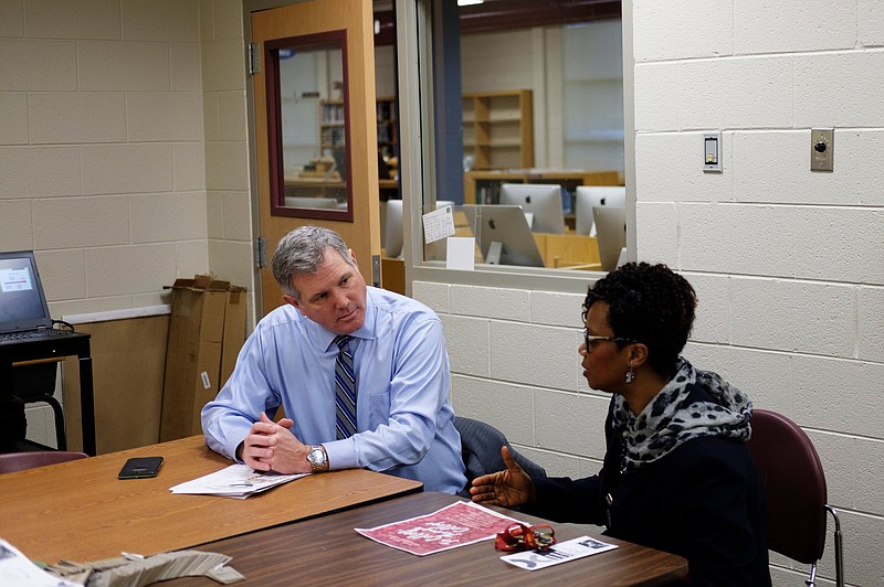 Principal LeAndrea Ware, right, speaks with Geoff Ramsey in an office as he shadows her for the morning at Howard School on Wednesday, Jan. 23, 2019, in Chattanooga, Tenn. Ramsey, the 2018 president of the Greater Chattanooga Association of Realtors, was one of 18 Hamilton County Schools' Leadership HCS participants who shadowed principals at schools across the county Wednesday.
