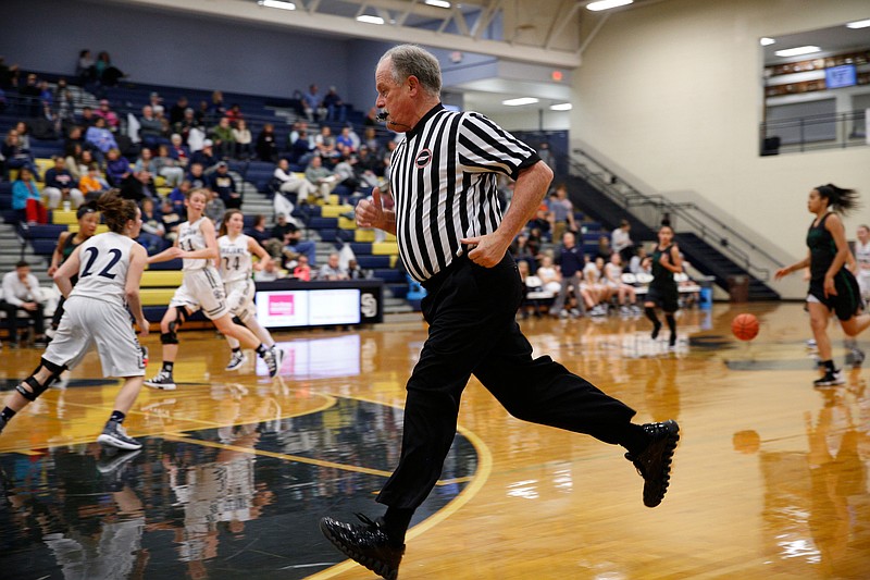 Referee Joe Scruggs officiates a girls' high school basketball game between East Hamilton and host Soddy-Daisy on Jan. 17. Scruggs has decades of experience and has worked nearly 6,000 games from the junior high to college level.