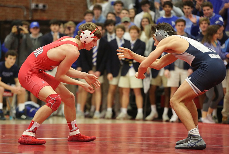 Baylor's Barrett Chambers, left, and McCallie's Frankie Zahrobsky compete in the 160-pound match during Friday night's dual meet at Baylor School. Chambers pinned Zahrobsky in the second period, and the host Red Raiders won 45-26.