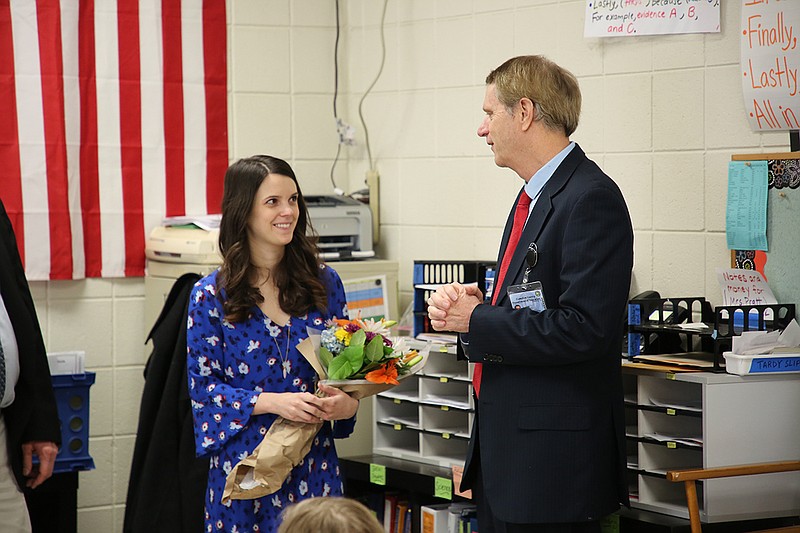 Dr. Larrie Reynolds, executive director of the Missionary Ridge Learning community, presents Sara Pratt with 2019 Hamilton County Teacher of the Year. (Photo courtesy of Tim Hensley/Hamilton County Schools)