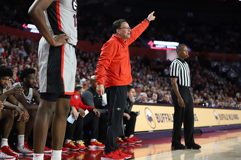 Georgia men's basketball coach Tom Crean directs his players during Saturday's 98-88 home victory over Texas in a Big 12/SEC Challenge game.