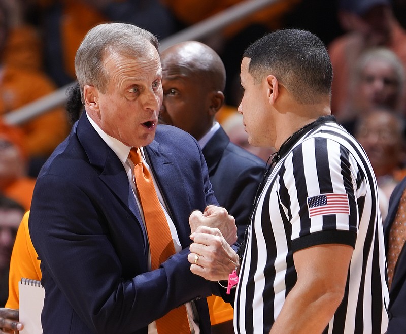Tennessee men's basketball coach Rick Barnes expresses to an official his disagreement with a foul called against Grant Williams during the Vols' home win against West Virginia in January.