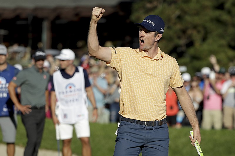 Justin Rose celebrates on the 18th green of Torrey Pines' South Course after winning the Farmers Insurance Open on Sunday in San Diego. Rose closed with a 3-under 69 to win by two strokes over Adam Scott.