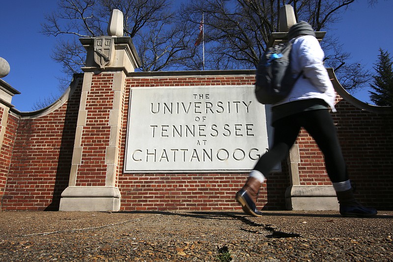 A student walks past a University of Tennessee at Chattanooga sign along McCallie Avenue Monday, January 28, 2019 in Chattanooga, Tennessee. Two women have filed a claim against UTC, alleging the university failed to enforce punishment against a man who assaulted them.