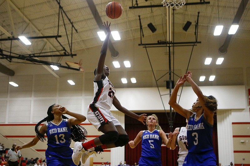 Signal Mountain's Lamiah Walker (23) goes up for a shot against Red Bank at Signal Mountain Middle/High School on Monday, Jan. 28, 2019 in Signal Mountain, Tenn.