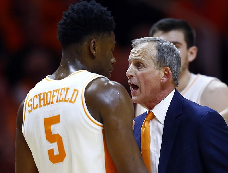 Tennessee men's basketball coach Rick Barnes talks to guard Admiral Schofield after he was called for a flagrant foul in the second half of the Vols' home win against West Virginia on Jan. 26.