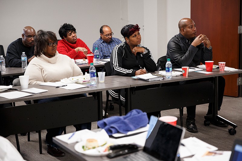 People listen to a speaker during a meeting to discuss a Faith-Based Health and Wellness Council held at Cempa Community Care Center on Saturday, Jan. 26, 2019, in Chattanooga, Tenn. The council hopes to address issues of health disparities in the city's must vulnerable communities.