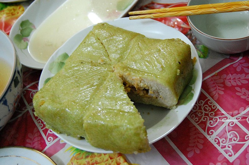 Among the traditional Vietnamese dishes served for the Tet holiday is banh chung, consisting of sticky rice stuffed with pork and mung bean.