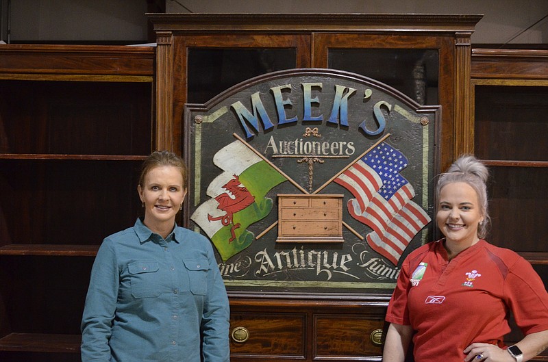 Josi Meek, left, and Victoria Meek-Underwood help their father, Les Meek, run The Insyde Outsyde Shop antique store and Meek's Auctions in Red Bank.