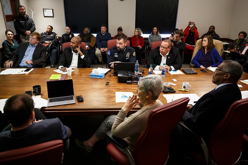 Police Chief David Roddy, center, speaks amongst councilors seated at a conference table during a City Council work session at the Chattanooga City Council building on Tuesday, Jan. 29, 2019, in Chattanooga, Tenn. Chief Roddy explained the departments policies for officer discipline and answered questions from councilors after a video depicting an officer punching a suspect was released earlier this month.