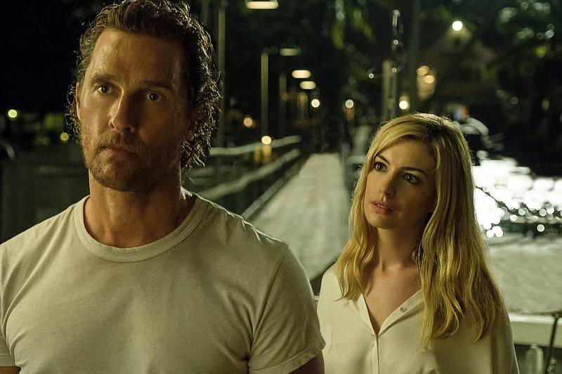 This image released by Aviron Pictures shows Matthew McConaughey, left, and Anne Hathaway in a scene from "Serenity." (Graham Bartholomew/Aviron Pictures via AP)

