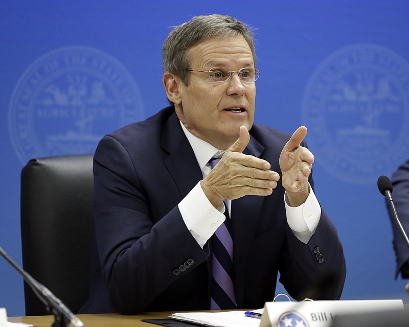 FILE - In this Jan. 25, 2019, file photo, Tennessee Gov. Bill Lee, right, asks a question on the first day of budget hearings in Nashville, Tenn. Lee and the top two GOP state lawmakers say they support a push to ban abortion once a fetal heartbeat is detected, as early as six weeks into a woman's pregnancy. (AP Photo/Mark Humphrey, File)
