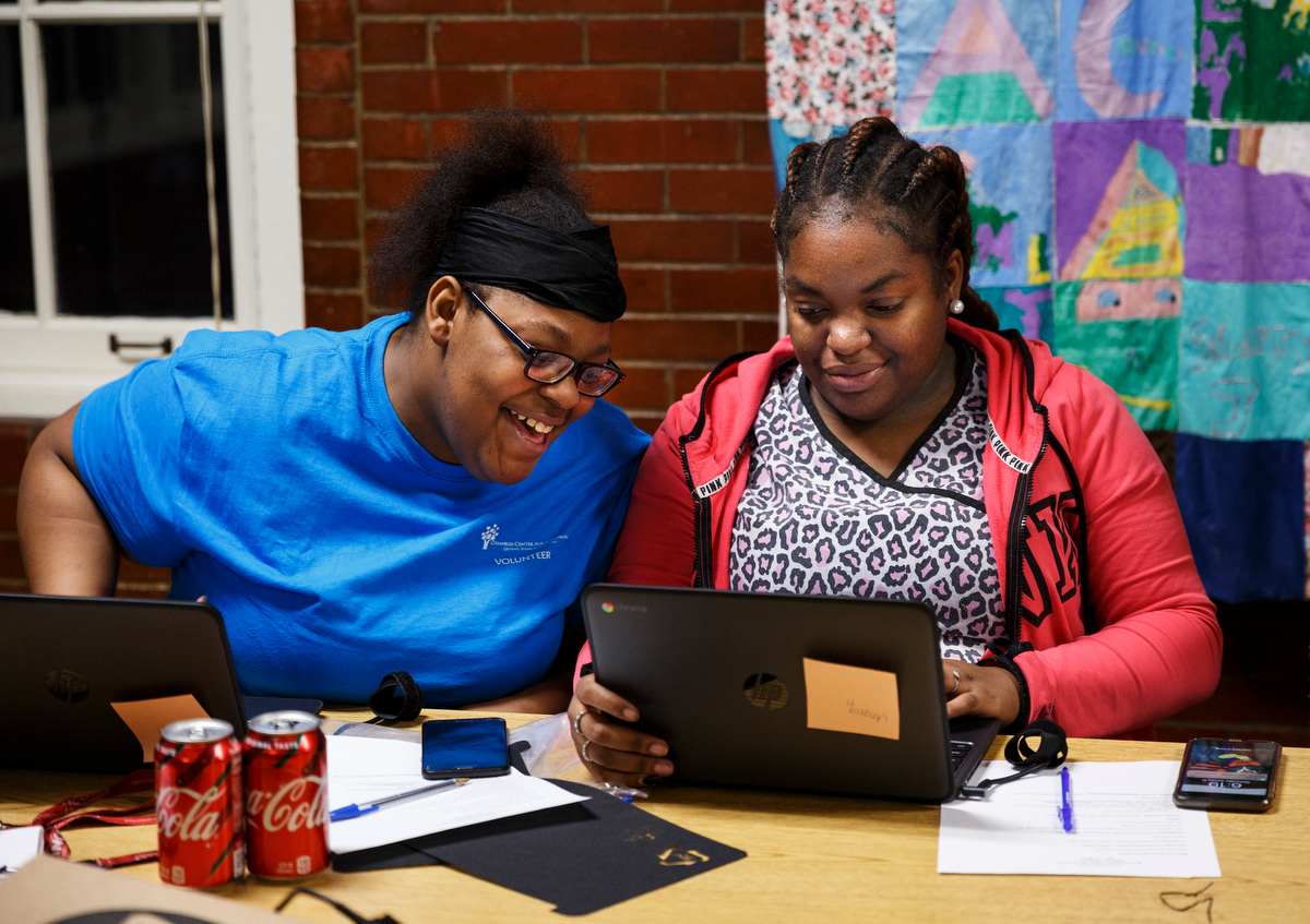 Alecia Miree, left, and Angela Harris set up their Chomebooks during a Tech Goes Home class at the Chambliss Center on Wednesday, Jan. 16, 2019, in Chattanooga, Tenn. Tech Goes Home is a digital inclusion program which provides technology training to children and adults from diverse socioeconomic backgrounds.