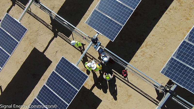 Contributed file photo / Workers for Chattanooga-based Signal Energy are shown at the mechanical commissioning of a California solar farm.