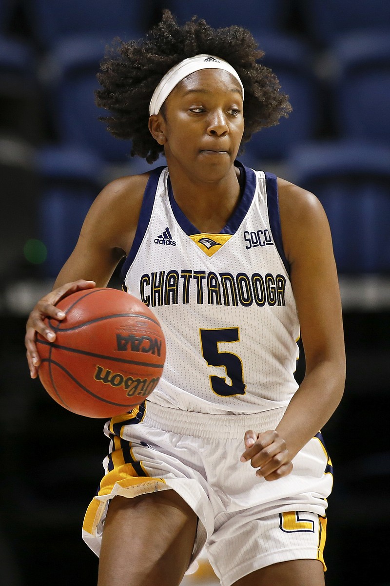 UTC forward Eboni Williams (5) dribbles the ball against Western Carolina during a Southern Conference basketball game at McKenzie Arena on Thursday, Jan. 31, 2019 in Chattanooga, Tenn.