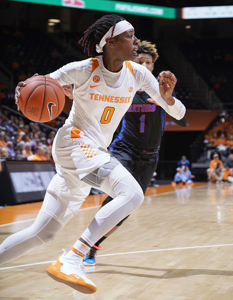 Tennessee's Rennia Davis drives down the baseline and past Florida's Kiara Smith during Thursday night's game at Thompson-Boling Arena in Knoxville. Tennessee won 67-50.