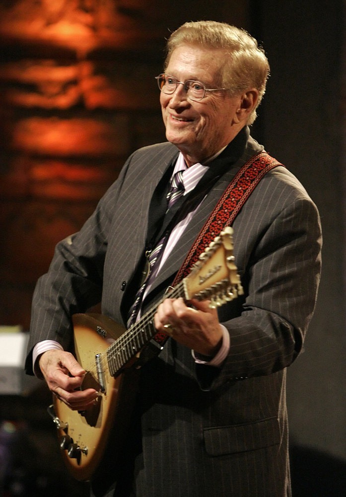 FILE - In this May 6, 2007 file photo, Guitar player Harold Bradley performs at the Country Music Hall of Fame Medallion Ceremony in Nashville, Tenn. Bradley, who played on hundreds of hit country records and along with his brother, famed producer Owen Bradley, helped craft "The Nashville Sound," has died. He was 93. His daughter Beverly Bradley said he died Thursday, Jan. 31, 2019 (AP Photo/Mark Humphrey, File)

