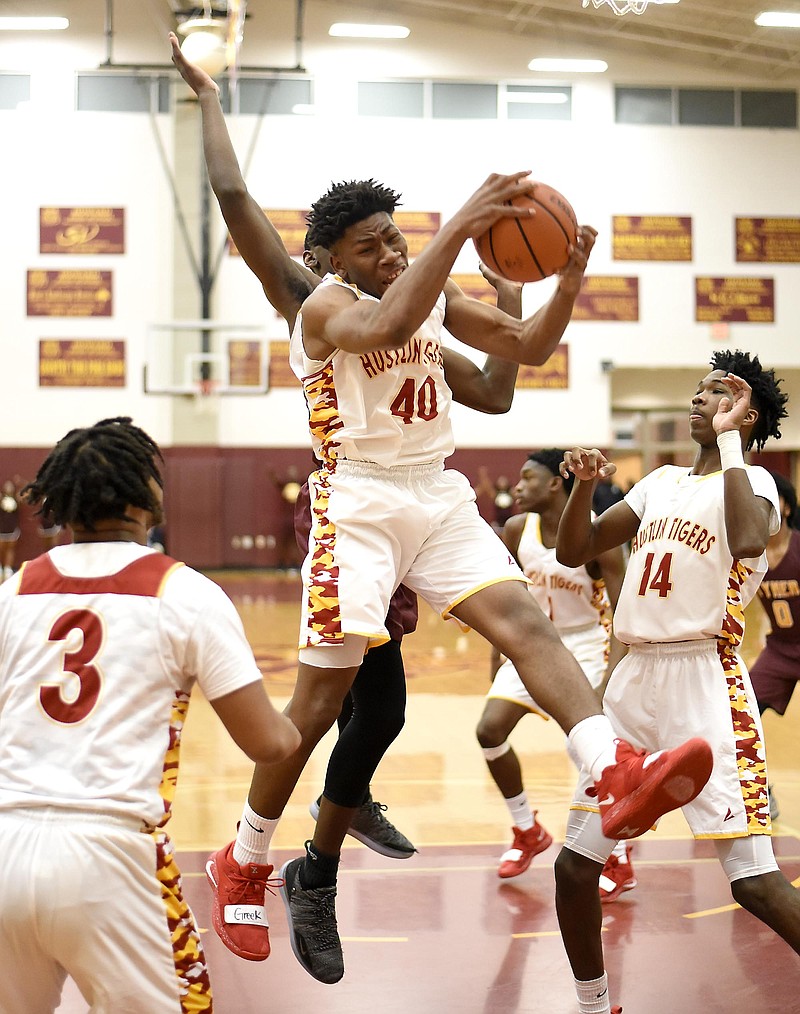 Telijah Snow (40) pulls down a rebound for Howard in the Hustlin' Tigers' 41-36 District 6-AA win Friday night over visiting Tyner.