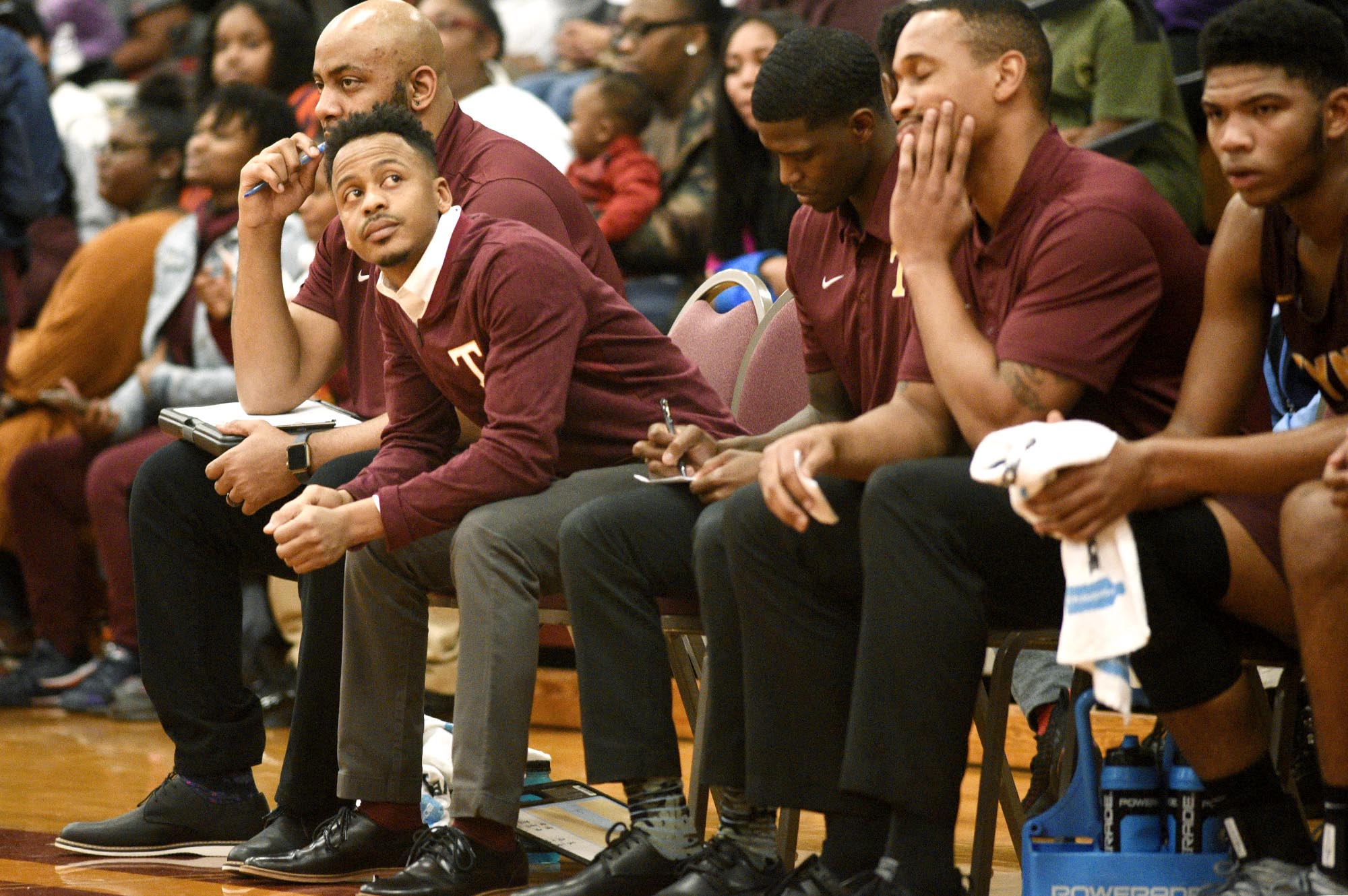 Tyner head coach E'Jay Ward, second from left, looks up at the clock as the Rams fall behind early. The Tyner Rams visited the Howard Hustling Tigers in TSSAA boys' basketball on February 1, 2019.